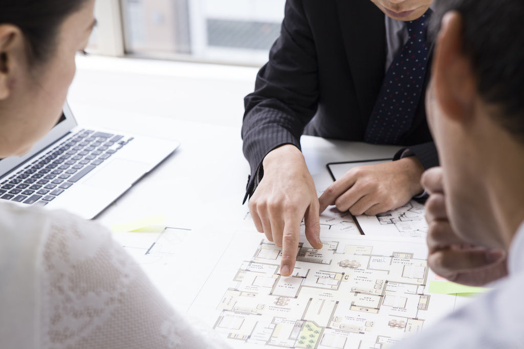 Couple reviewing apartment community layout